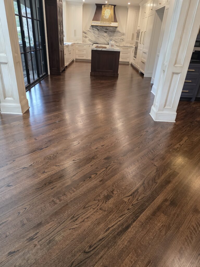 Dark stained oak hardwood floor in a finished kitchen by Phoenix